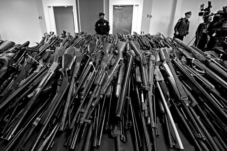 Rifles are turned in during a 2012 gun buyback program in Camden.