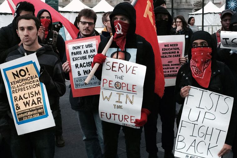 Coalition of anti-war activists rallied outside City Hall to denounce racism against Syrian immigrants and bombing of Syria.