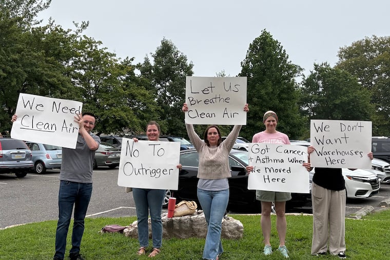 Residents protest outside a meeting of the Middletown Township Council on Aug. 6 at Indian Lane Elementary School. The council unanimously denied a proposed 330,000-square-foot warehouse that drew large protests from local residents, who said the warehouse would bring additional traffic, air pollution, and safety risks.