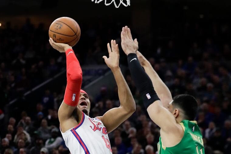 Sixers forward Tobias Harris shoots the basketball over Boston Celtics center Enes Kanter during the first-quarter on Thursday, January 9, 2020 in Philadelphia.