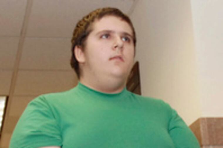 Dillon Cossey, 14, is led into a Montgomery County courtroom for his hearing. He remains in custody.