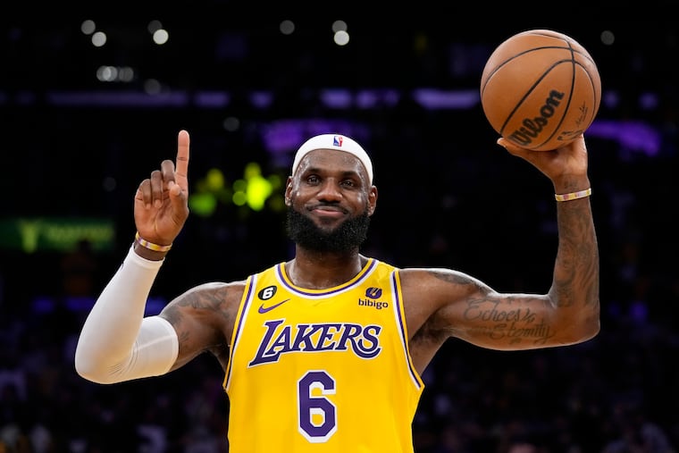 Los Angeles Lakers forward LeBron James gestures after passing Kareem Abdul-Jabbar to become the NBA's all-time leading scorer.