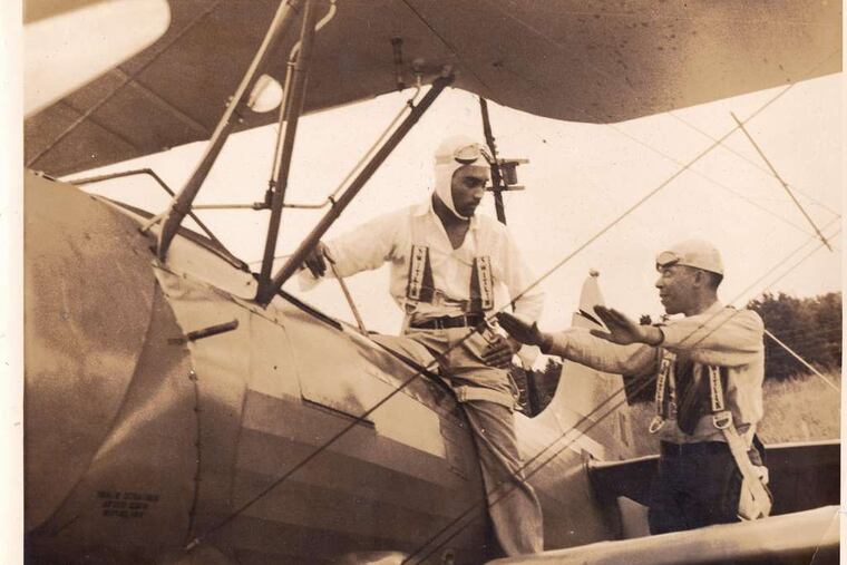 C. Alfred "Chief" Anderson (right) trains fellow Tuskegee Airman Erwin B. Lawrence.
