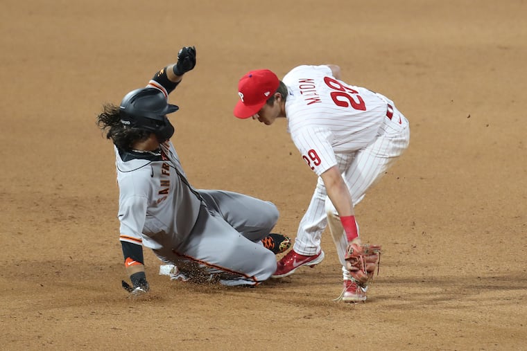 Rookie shortstop Nick Maton tags out Brandon Crawford of the Giants.
