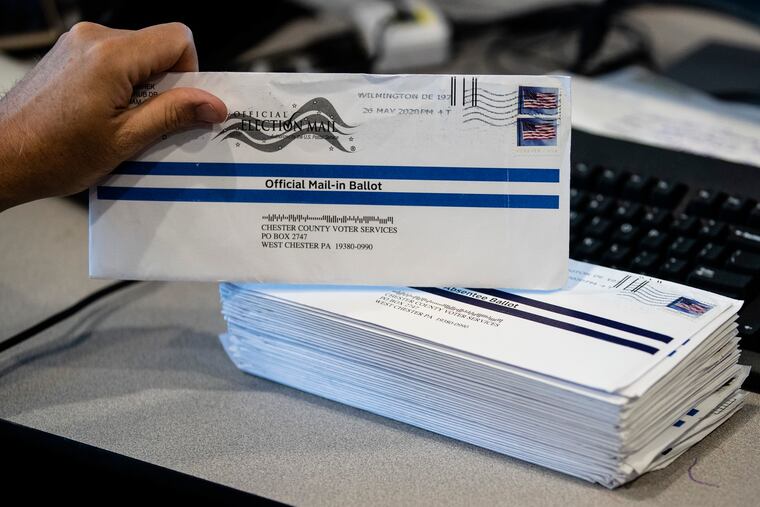 Mail-in primary election ballots are processed at the Chester County Voter Services office in West Chester, Pa.