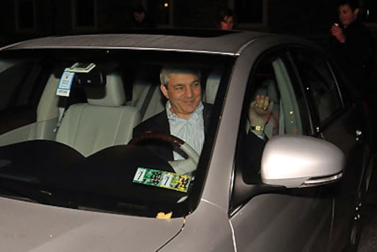 Penn State president Graham Spanier in his car after the school's board of trustees met last night. (Chloe Ellmer/Daily Collegian/AP)