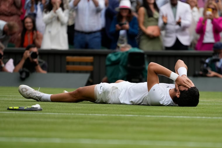 Spain's Carlos Alcaraz celebrates after beating Serbia's Novak Djokovic to win Wimbledon.