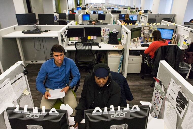 Benefits Data Trust has call-center employees, shown here before the pandemic, screen individuals who may be eligible for government benefits.