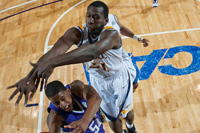 Kevin Phillip (right) is one of two Drexel players charged with robbing a classmate at gunpoint. (Scott K. Brown/AP file photo)