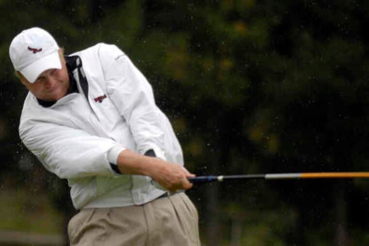 St. Joseph's golfer Bill Macknis tees off during the Big Five Invitational at the Philadelphia Cricket Club.