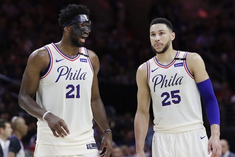 Center Joel Embiid (left) and point guard Ben Simmons led the Sixers to a turnaround season.