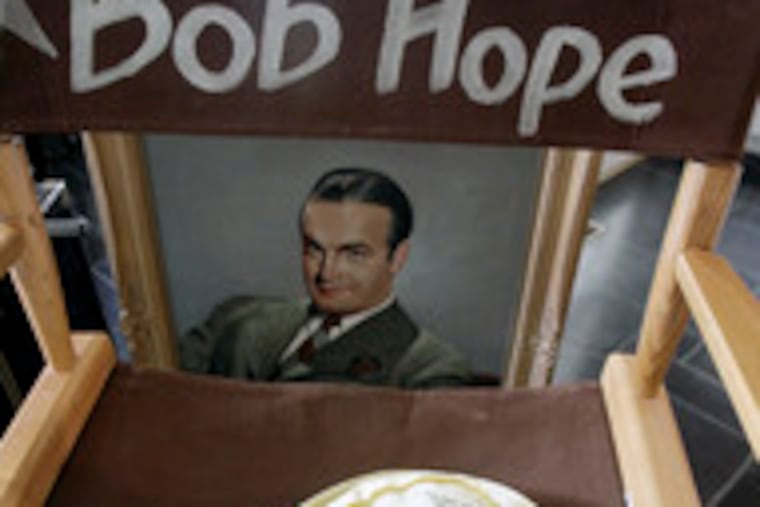 Hope auction: Items for sale include a chair, portrait, golf hat.