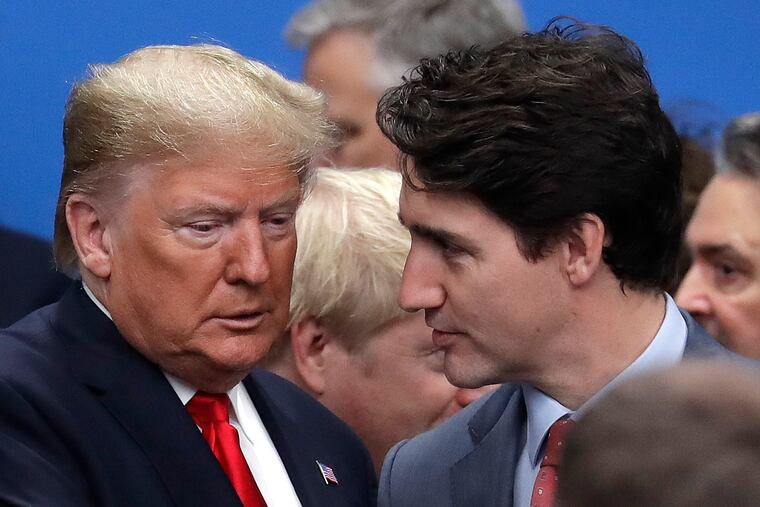 President Donald Trump (left) and Canadian Prime Minister Justin Trudeau during a NATO leaders meeting in England on Wednesday.