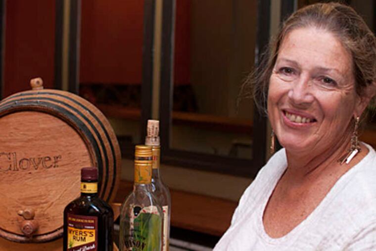 Anne Frey at her 1 Tippling Place with ingredients for Fish House Punch. (Abi Reimold/Staff)