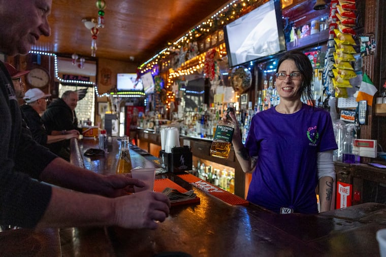 Jen Bird, of Port Richmond, bartender, making some drinks for folks at J.R’s Saloon in Philadelphia on Thursday, Dec. 18, 2025.