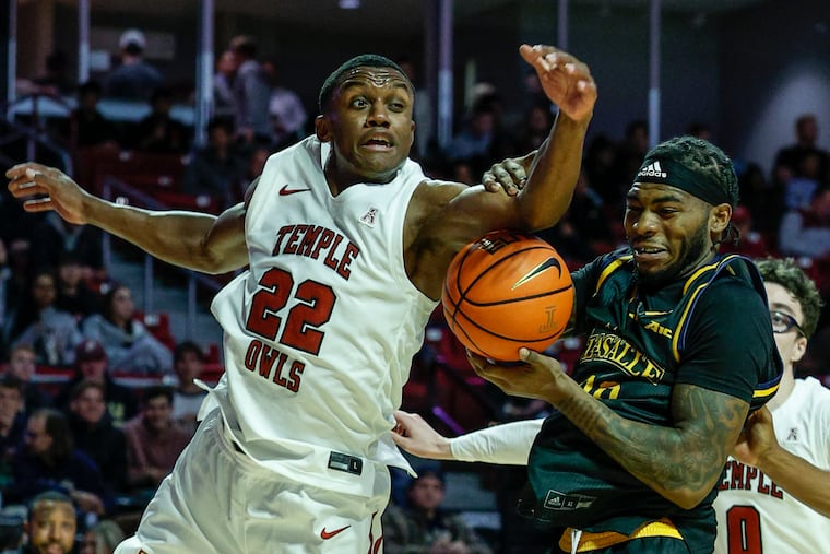Temple's Derrian Ford and La Salle's Rob Dockery try to grab a rebound on Tuesday night.