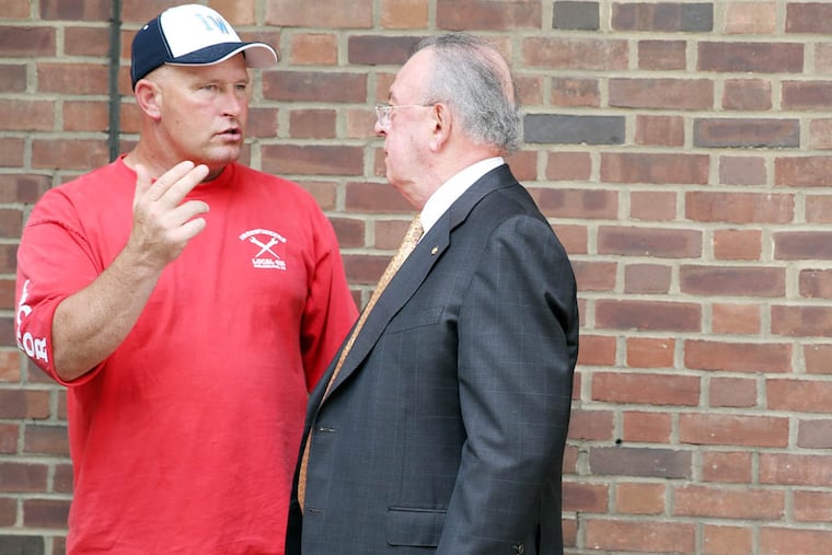 Richard Ritchie, left, talks with Joseph Dougherty, right, outside the U. S. courthouse in Philadelphia on August 14, 2014. They are two of 10 defendants in the Ironworkers RICO-conspiracy case.. DAVID MAIALETTI / Staff Photographer