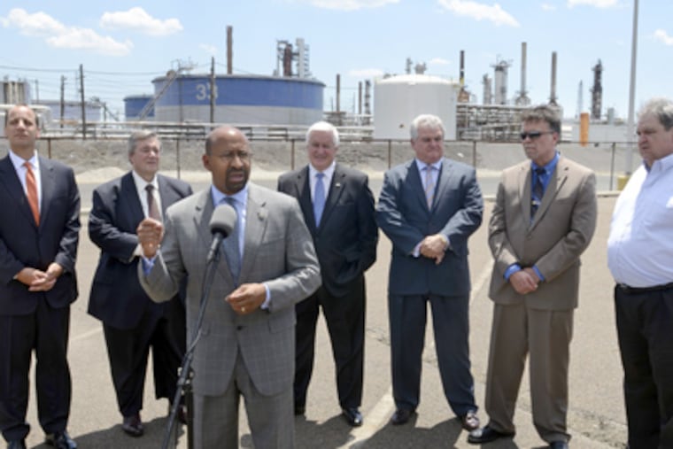 Mayor Michael Nutter speaks during press conference outside Sunoco's Philadelphia refinery on Passyunk Avenue July 2, 2012. Behind him (from left) are David Marchick, Managing Director, The Carlyle Group; Philip Rinaldi, chief executive of Philadelphia
Energy Resources; Governor Tom Corbett; U.S. Representative Robert Brady; Jim Savage Local 10-1, United Steelworkers; and Tom Conway, International Vice President, United Steelworkers Union. (Tom Gralish / Staff Photographer)
