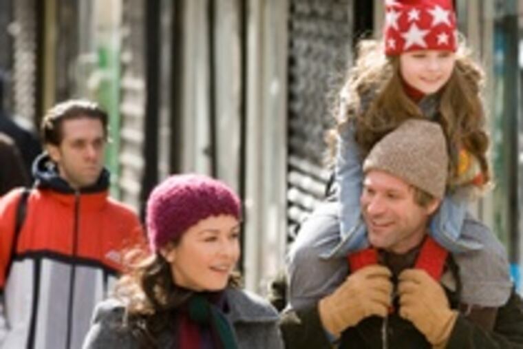 Catherine Zeta-Jones as Kate, Aaron Eckhart as Nick, Abigail Breslin as Zoe in the romantic comedy/drama "No Reservations."