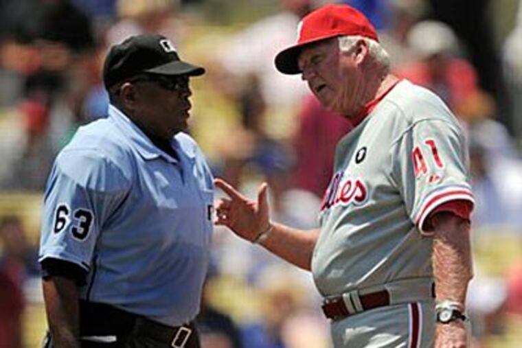 Charlie Manuel argues with the umpire during the Phillies' win over the Dodgers on Wednesday. (Mark J. Terrill/AP)