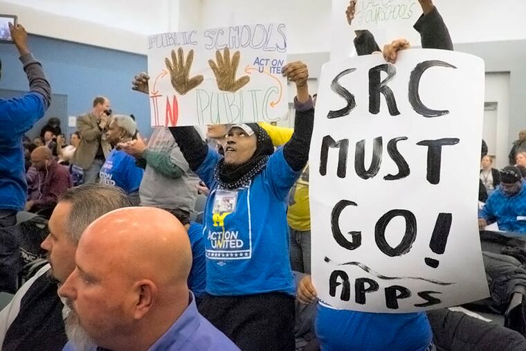 Protestors who were not in favor of charter schools disrupted the opening proceedings of the School Reform Commission meeting Wednesday, February 18, 2015 . ( ED HILLE / Staff Photographer )