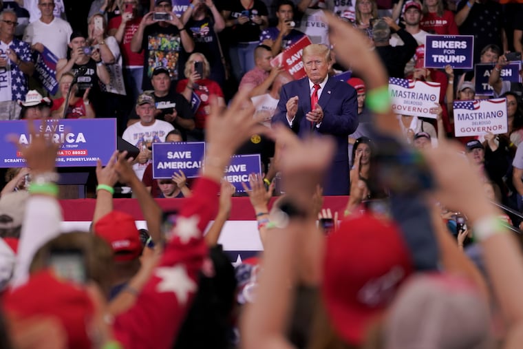 Former President Donald Trump speaks at a rally in Wilkes-Barre, Pa., Sept. 3, 2022. Trump is increasingly embracing and endorsing the QAnon conspiracy theory, even as the number of frightening real-world incidents linked to the movement increase.