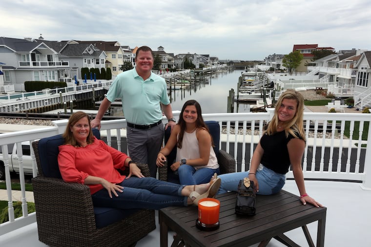 From left, Heather and Kevin Decosta, with daughters, Shannon and Morgan, on the upper deck overlooking the back bay at their Ocean City home.