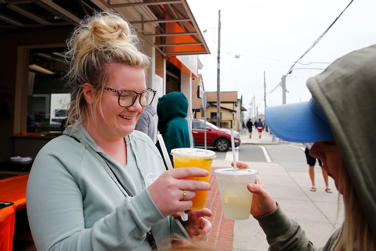 Bridget Tobin (left) and Colleen Koelzer, both from Bucks County, toast each other with a drink from Joe Joe's Place Tacos and Tequila in North Wildwood in 2020, as New Jersey started to allow cocktails to go.