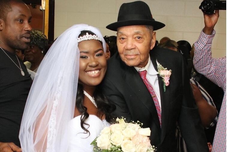 Mr. Robinson, here with his granddaughter Marlena Ellis, looked out for his family and neighbors in Strawberry Mansion, and was the patriarch of his family.