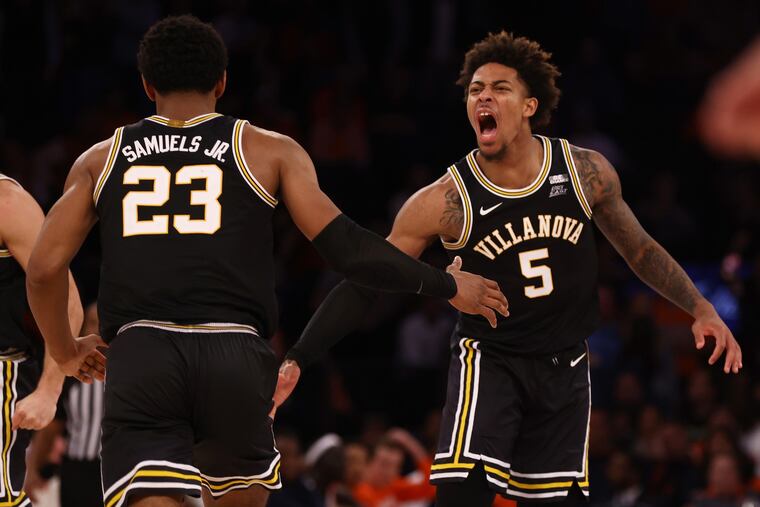 Villanova's Justin Moore (5) celebrates with teammate Jermaine Samuels (23) during action against Syracuse during the Jimmy V Classic at Madison Square Garden on Tuesday.