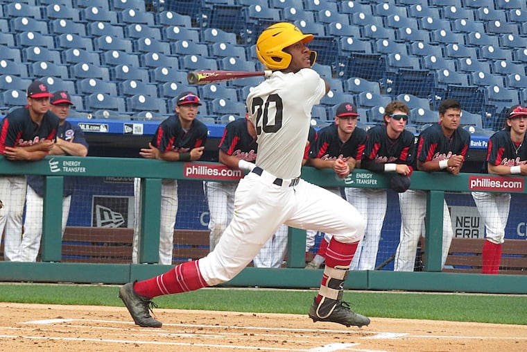 Burlington County centerfielder R.J. Moten of Delran hits a triple in the first inning against the Philadelphia Catholic League.