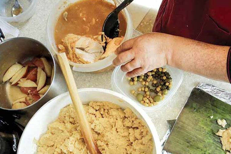 Ingredients are ready to fill as Dora Gonzales and her daughter, Cynthia, prepare traditional Salvadoran tamales from an ancient family recipe in Inglewood, Calif. (Doriane Raiman/Los Angeles Times/MCT)