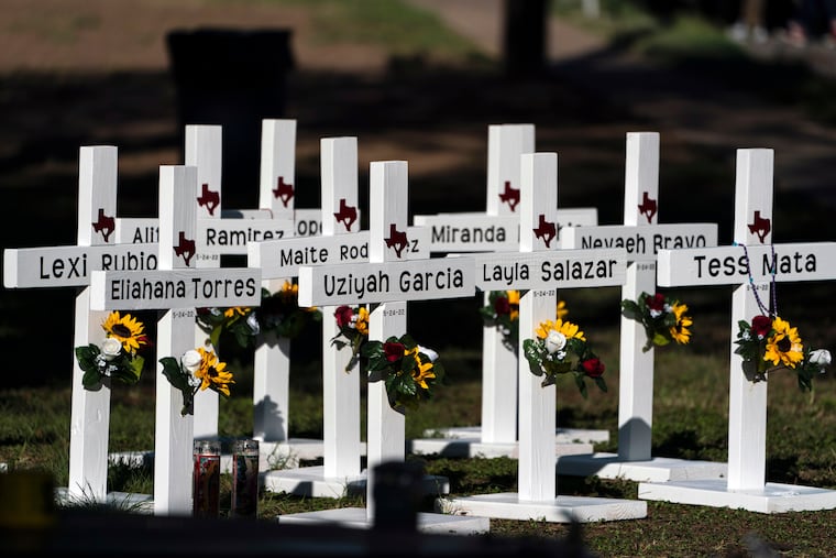 Crosses with the names of shooting victims are placed outside Robb Elementary School in Uvalde, Texas, May 26, 2022. The founder of Mithril Defense, which is making drones for defensive use in schools, says the shooting in Uvalde inspired the project.