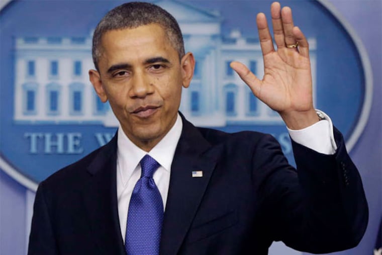 President Obama waves as he leaves the podium after speaking about the fiscal cliff on Friday. (AP Photo)
