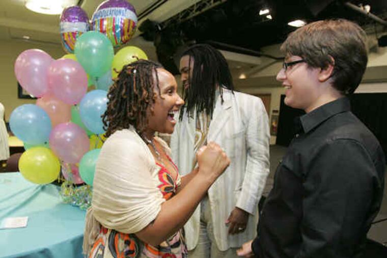 Karen Campbell (left), program director of the White-Williams Scholars' College Connection program, talks with graduate Kyle Werder about his college plans.