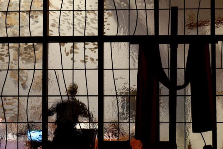 The Rev. Richard Napoli, seen through stained glass, is among 25 presenters the Archdiocese of Philadelphia has trained to educate lay Catholics about the World Meeting of Families in the months ahead. (TOM GRALISH / Staff Photographer)