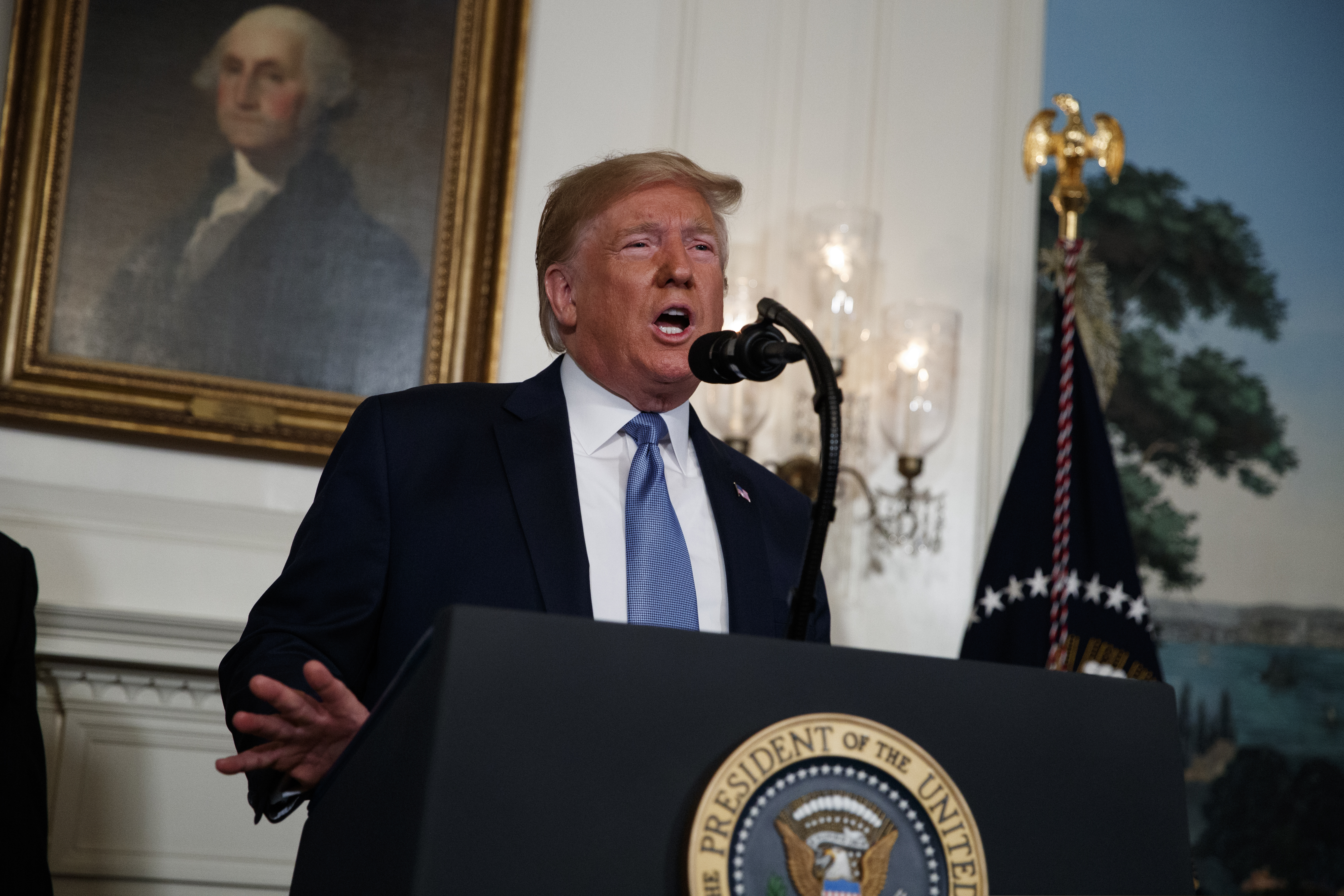 President Donald Trump speaks about the mass shootings in El Paso and Dayton from the Diplomatic Reception Room of the White House on Monday.