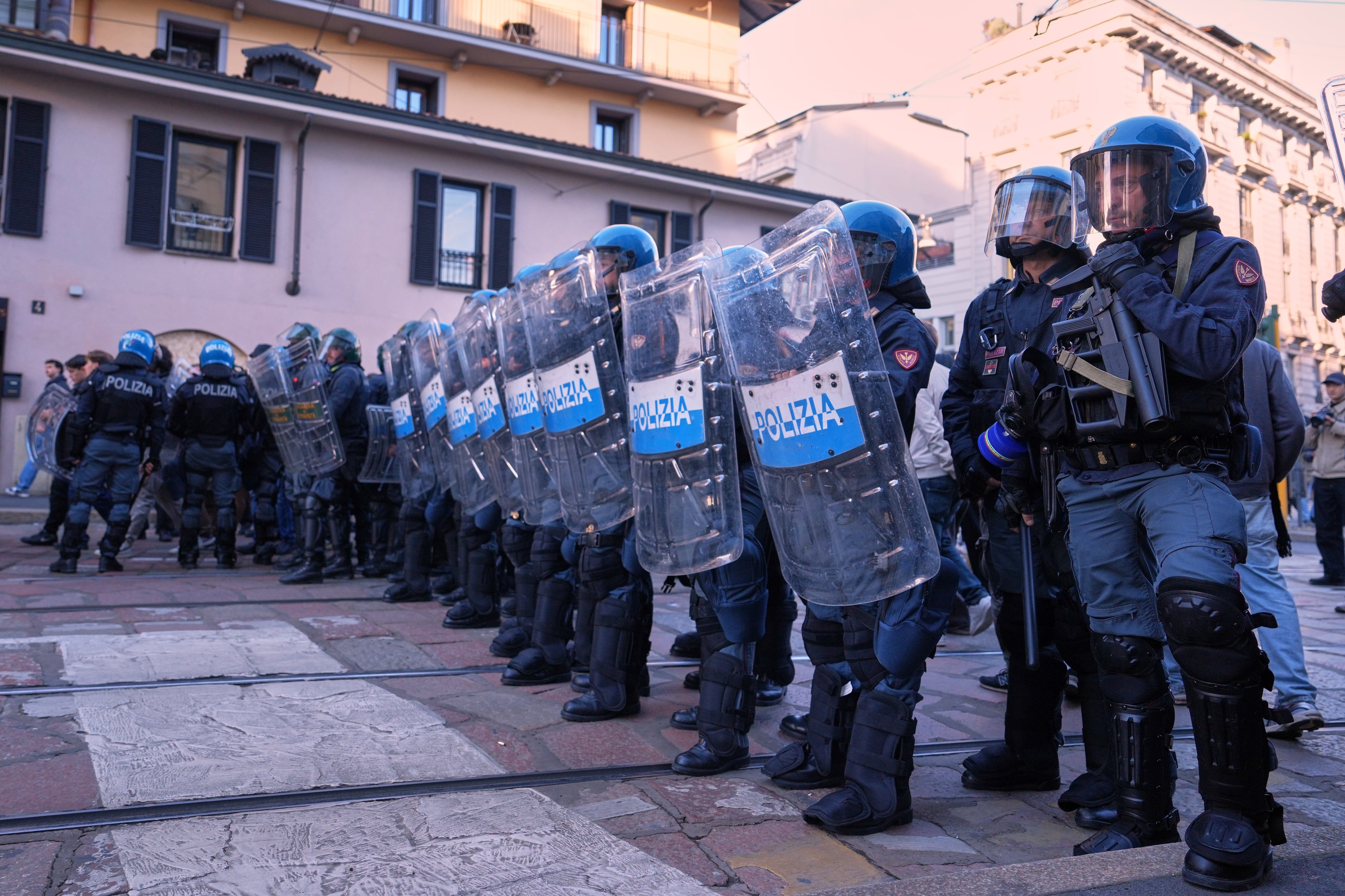 Soldiers guard center of Milan as thousands of protesters march across European cities