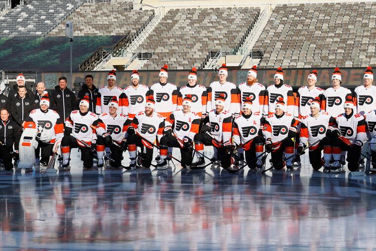 The Flyers posed for a team picture at their Stadium Series practice on Friday.