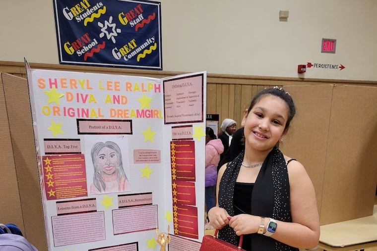 Emily Fleming, 10, a student at Thomas W. Holtzman Jr. Elementary School in Susquehanna Township, with her school project about "Abbott Elementary" star Sheryl Lee Ralph.