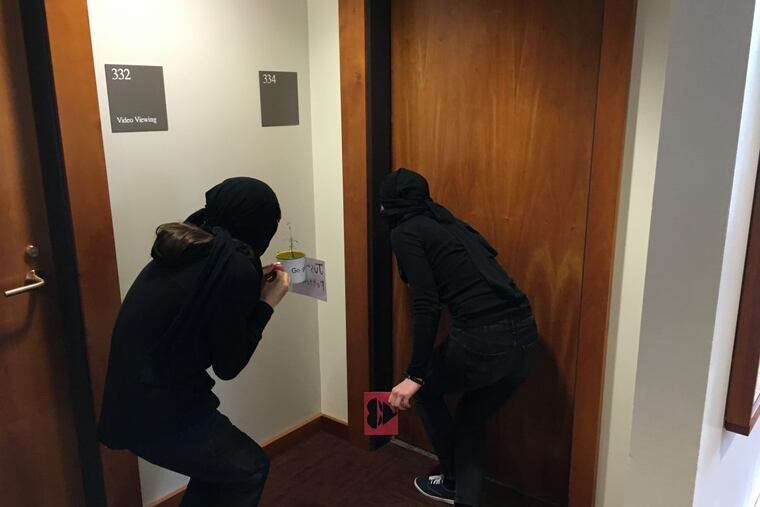 Ninja Valentine deliverers close in on a classroom at Swarthmore College.