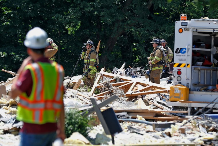 FILE - In this July 2, 2017, file photo, firefighters work the site of a house that exploded in Millersville, Pa.