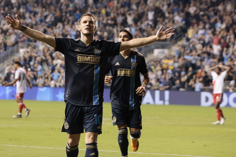 Dániel Gazdag (left) celebrates scoring the first of his two goals against New England.