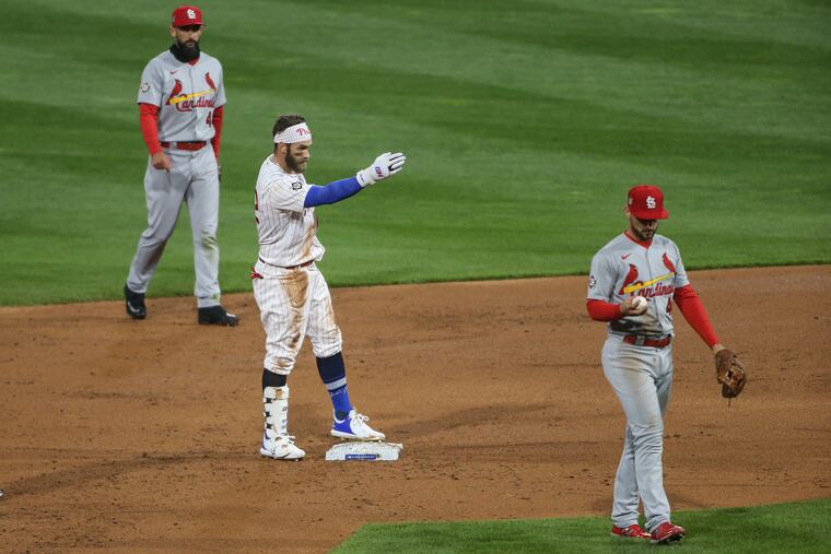 Bryce Harper motions to the dugout after sliding into second base with a two-run double in the Phillies' six-run second inning Friday night at Citizens Bank Park.