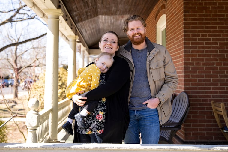Alex and Bridget Felts with daughter, Rowen, at their home in Lansdale.