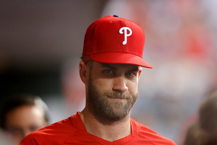 Bryce Harper in the Phillies dugout during the game against the Washington Nationals on Friday.
