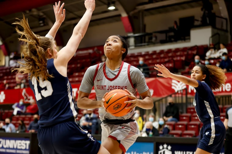 Laila Fair of St. Joseph's University drives to the basket.