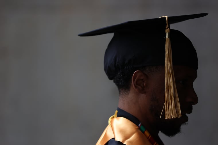 Clifton Young, a double major in business leadership and construction management, walks into the Liacouras Center in North Philadelphia before the Community College of Philadelphia commencement ceremony in May.