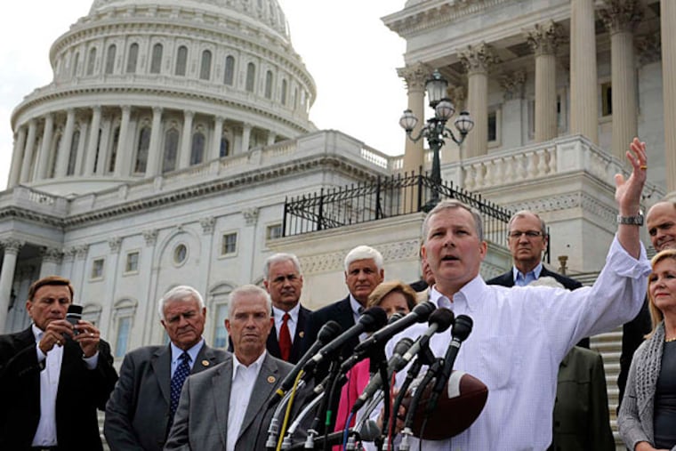 Rep. Tim Griffin of Arizona is joined by other House Republicans as he calls on Senate Democrats to "come back to work." A partial shutdown could begin Tuesday if no accord is reached. (Cliff Owen/AP)