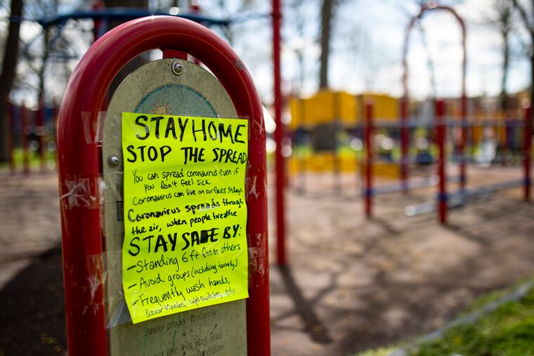 Signs warning locals coming to the parks to stay at home at Malcolm X Park ini April.